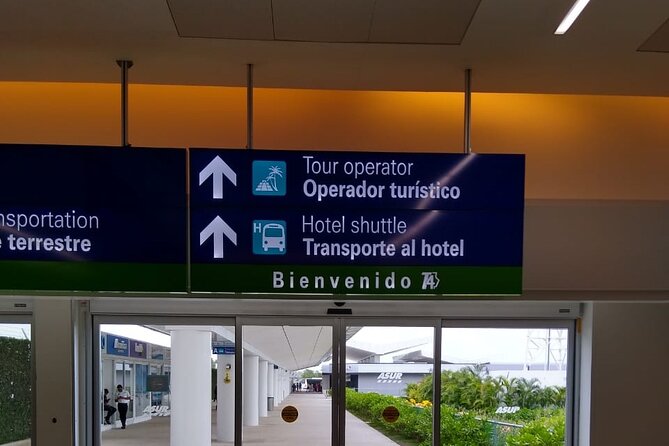 Airport Transfers to Puerto Aventuras - Private van (ROUND TRIP) FLAT RATE - Finding Your Driver at the Terminal: Banner Sign and Flight Tracking