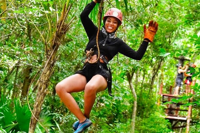 ATV, Ziplines and Mayan Cenote Extreme Experience - Zip lines with safety gear and a camera restriction you should plan for
