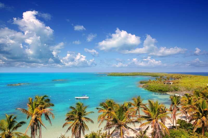 Full Day Nature Expedition to Contoy Island and Isla Mujeres - Getting there: pickup, the AC van, and the first boat ride