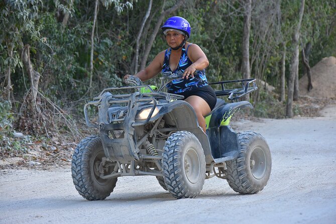 Tulum's Thrilling Jungle: ATV, Zip Lines, Cenote & More! - Cenote swimming and exploration: lifejacket included, plus that cave vibe